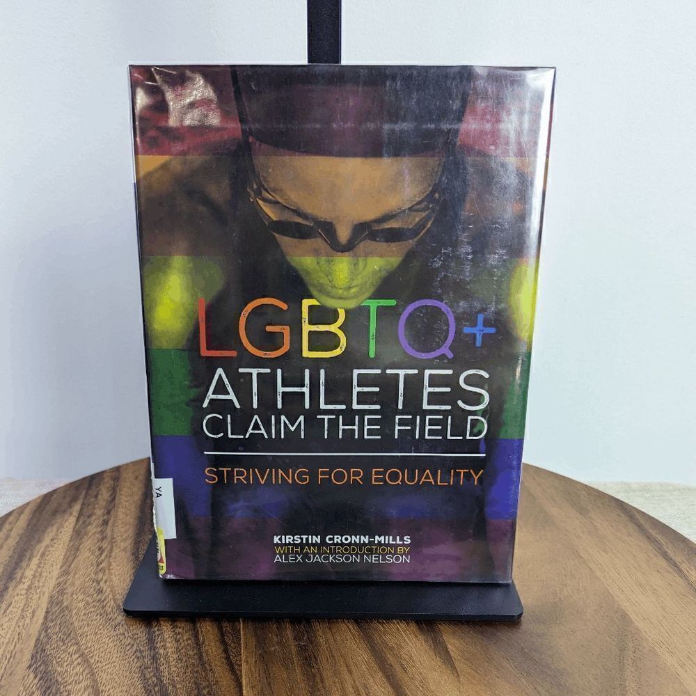 LGBTQ+ Athletes Claim the Field: Striving for Equality Library Binding – August